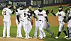 The Doosan Bears celebrate after beating the Samsung Lions in the second round of the playoffs on Wednesday at Jamsil Baseball Stadium in southern Seoul. [NEWS1]
