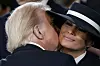 U.S. President Donald Trump kisses first lady Melania Trump after he was sworn in during the 60th Presidential Inauguration in the Rotunda of the U.S. Capitol in Washington, Jan. 20. [AP/YONHAP]