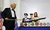U.S. President Donald Trump cuts a cake with a sword during the Commander in Chief Ball in honor of the inauguration of President Donald Trump in Washington, U.S., Jan. 20. [REUTERS/YONHAP]