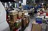 Employees at a logistics center in Songpa District, Eastern Seoul, sort parcels on June 9. [YONHAP]