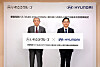 Hyundai Mobility Japan CEO Cho Won-sang, right, poses with Iwasaki Group CEO Yoshitaro Iwasaki after signing a letter of intent to supply five electric buses to the company on Thursday. The Elec City Town buses will run on routes on Yakushima Island. [HYUNDAI MOTOR]