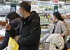 Customers shop at a grocery store in Seoul on Monday. [YONHAP]