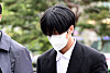 Rapper Ravi attends the Seoul Southern District Court on Tuesday. [NEWS1]