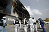 Officials from the National Forensic Service, Gyeonggi Province Fire Services and police inspect Coupang’s Deokpyeong Logistics Center in Icheon, Gyeonggi, to find out the cause of a fire on June 29. [YONHAP]