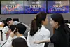 A screen in Hana Bank's trading room in central Seoul shows stock and foreign exchange markets close on Wednesday. [YONHAP]