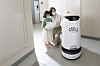 A Dilly Tower robot delivers food to models at an apartment building in Yeongdeungpo District, western Seoul. [WOOWA BROTHERS]