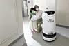 A Dilly Tower robot delivers food to models at an apartment building in Yeongdeungpo District, western Seoul. [WOOWA BROTHERS]