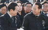 Kwon Young-se, right, chief of the ruling People Power Party's emergency leadership committee, speaks with Lee Jae-myung, leader of the main opposition Democratic Party, during a memorial service for late former National Assembly Speaker Kim Soo-han at the parliamentary building in Seoul on Jan. 3. [NEWS1]