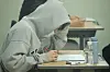 A student waits at a class room in Sejong to take the College Scholastic Ability Test (CSAT) on Thursday. [YONHAP]