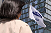 A woman stands in front of Samsung Electronics headquarters at Seocho District, southern Seoul. As of June last year, Samsung Electronics ranked first among domestic companies in the number of employees, with 124,070 workers. [NEWS1]