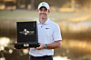 Rory McIlroy holds the CJ Cup trophy after the final round of the CJ Cup at Congaree Golf Club on Sunday in Ridgeland, South Carolina. [GETTY IMAGES FOR THE CJ CUP]