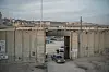 An Israeli officer directing traffic at the Qalandia checkpoint between Ramallah, in the Israelioccupied West Bank, and Jerusalem on Dec. 3, 2023. Spain, Norway and Ireland said on May 22, 2024 that they would recognize an independent Palestinian state, a rebuke to Israel over its war in Gaza and its decades of occupation of Palestinian territories. [Sergey Ponomarev/The New York Times]
