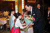 President Yoon Suk Yeol and first lady Kim Keon Hee, right, receive flowers from children during a dinner meeting with Koreans residing in France at a hotel in Paris Monday evening. [JOINT PRESS CORPS]
