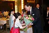 President Yoon Suk Yeol and first lady Kim Keon Hee, right, receive flowers from children during a dinner meeting with Koreans residing in France at a hotel in Paris Monday evening. [JOINT PRESS CORPS]
