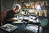 Lee Wan-kyu demonstrates reproducing Danyusemungyeong, a bronze mirror with geometric patterns, at his studio in Yongin, Gyeonggi. [PARK SANG-MOON]