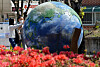 Children explore a globe set up in Geumsan County, South Chungcheong, on Monday. The globe was set up to mark Earth Day on April 22.   [KIM SEONG-TAE]
