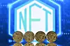 An illustration picture taken in London on December 30, 2021, shows gold plated souvenir cryptocurrency coins arranged by a screen displaying a NFT (Non-Fungible Token) logo. [AFP/YONHAP]