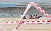 Tourists sit maskless in the sand behind the control line at Eurwangni Beach in Incheon on Sunday, despite the temporary closure of four major beaches in Incheon, including Eurwangni, Wangsan, Hanagae and Silmi, following the Level 4 measures applied in the region. Incheon temporarily closed beaches in Jung District until July 25 and banned the use of shower rooms, parasols, tents and rental facilities. [NEWS1]