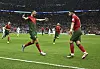 Bruno Fernandes of Portugal, right, celebrates his goal with teammate Cristiano Ronaldo during the Group H match between Portugal and Uruguay at the 2022 FIFA World Cup at Lusail Stadium in Lusail in Qatar on Monday. A double from Fernandes shut out Uruguay 2-0 and earned Portugal a seat in the knock out round. [XINHUA/YONHAP]