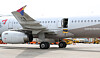 The emergency exit of Asiana Flight 8124 is open while the plane while the plane is on the ground at Daegu International Airport on May 26. A 33-year-old passenger swung open the door just minutes before landing that day. [NEWS1]