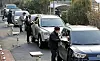 At Yongin High School in Busan on Wednesday, teachers hand out College Scholastic Ability Test scores to students in passenger cars to abide by stricter social distancing measures. [SONG BONG-GEUN]