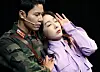 Actors Lee Kyu-hyung, left, and Kim Ryeo-won as Ri Jeong-hyuk and Yoon Se-ri during a scene of the musical 'Crash Landing On You' at COEX Shinhan Card Artium in Gangnam District, southern Seoul. [NEWS1]