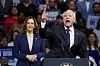 U.S. Vice President and Democratic presidential candidate Kamala Harris, left, stands next to her newly chosen vice presidential running mate, Minnesota Gov. Tim Walz, as he speaks during a campaign rally in Pennsylvania on Tuesday. [REUTERS/YONHAP]