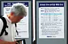 A man walks past posters announcing Korail's train ticket reservations. [YONHAP]