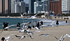 People visit Haeundae Beach in Busan to enjoy the spring-like weather on Sunday. [SONG BONG-GEUN]