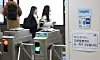 Commuters at Seoul Station in central Seoul on Sunday walk past a sign showing that Seoul’s Climate Card, an unlimited transit pass aimed at reducing pollution in the city by encouraging people to use more public transportation, has been implemented since Saturday. The Seoul Metropolitan Government said that around 71,000 people used the Climate Card on the first day of its launch. Commuters can pay around 65,000 won ($48) per month for these passes to use subways, buses and public bicycles without limits. [YONHAP]