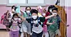 Children who just ended their last day of classes run out of the school in Gangseo District, western Seoul, on Thursday. [NEWS1]