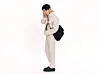 Zico in photos from Fendi's 2022 S/S Capsule Collection. Above he is shown wearing a Fendi Baguette messenger bag. [FENDI]