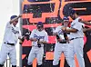 From left: Jeong Keun-woo, Kwak Yoon-gy and Ashton Lansdell of the Los Angeles Dodgers cover teammate Adrian Gonzalez with champagne after he was named MVP at the 2022 FTX MLB Home Run Derby X at Paradise City in Incheon on Saturday. [YONHAP]