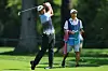 Hideki Matsuyama plays a shot on the 12th hole as his caddie Shota Hayafuji looks on during a practice round prior to the BMW Championship at Olympia Fields Country Club in Olympia Fields, Illinois, on Wednesday. [GETTY IMAGES]