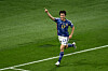 Japan's midfielder Ao Tanaka celebrates scoring his team's second goal with his teammates during the Qatar 2022 World Cup Group E football match between Japan and Spain at the Khalifa International Stadium in Doha on Thursday. [AFP/YONHAP]