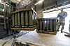 A U.S. Air Force Staff Sergeant inspects pallets of 155 mm shells at Dover Air Force Base, Delaware, on April 29, 2022. [AP]