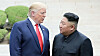 U.S. President Donald Trump, left, and North Korean leader Kim Jong-un cross into the South after greeting each other at the inter-Korean border village of Panmunjom on June 30, 2019. [YONHAP]