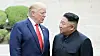 U.S. President Donald Trump, left, and North Korean leader Kim Jong-un cross into the South after greeting each other at the inter-Korean border village of Panmunjom on June 30, 2019. [YONHAP]
