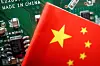 A Chinese flag is displayed next to a ″Made in China″ sign seen on a printed circuit board with semiconductor chips. [REUTERS/YONHAP]