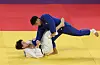 Lee Ha-rim, wearing white, loses to Chinese Taipei's Yang Yun Wei in the final match of the men's judo -60 kilograms division at the 19th Asian Games in Hangzhou, China on Sunday. [YONHAP]