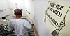 A patient walks beside a poster on the wall, which reads that four months have passed since junior doctors walked out, in a general hospital in Seoul on Monday. [NEWS1]