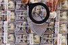 A worker checks $100 bills at a bank branch of Hana Bank in central Seoul on Oct. 10, 2025. [YONHAP]