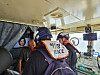 A Mokpo Coast Guard officer explains to the captain of a ship carrying large engines why his vessel was being searched on April 11.
