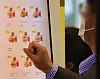 A customer selects menu items from a kiosk at a McDonald's in downtown Seoul on Wednesday. McDonald's Korea will raise its prices by an average of 4.8 percent starting Thursday, in a second price hike this year after the fast food chain raised prices by an average of 100 to 300 won (7 to 22 cents) in February. Burger franchises are not the only ones upping costs — chicken and pizza franchises and coffee chains have also increased their prices in recent weeks. [NEWS1]