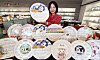 Ceramic plates decorated with the calendar for 2024, the Year of the Blue Dragon, are displayed at a Hankook Chinaware store in Dongdaemun District, eastern Seoul. The Asian lunar year starts on Feb. 10. [YONHAP]