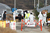 A government official blocks the entrance to a pig farm in Cherwon County, Gangwon, on Nov. 10, 2021. [YONHAP]