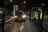 Police stop a car on a road near Marronier Park in central Seoul Wednesday night ahead of a planned drive-through rally by small business owners. [YONHAP]
