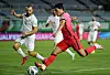 Hwang Hee-chan, right, plays the ball in the third round of qualifiers for the 2022 Qatar World Cup at Ansan Wa Stadium in Ansan, Gyeonggi on Thursday. [NEWS1]