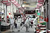 Workers in full protective gear disinfect a traditional outdoor market in Gwangju on Wednesday as Chuseok, or the Korean harvest holiday, approaches. [YONHAP]