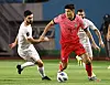 Kim Min-jae dribbles past Syria at the third round of qualifiers for the 2022 Qatar World Cup at Ansan Wa Stadium in Ansan, Gyeonggi on Thursday. [YONHAP]